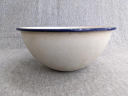 Two enamelware bowls; larger bowl measures 6" x 3". Smaller bowl has a beautiful blue and white