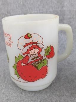 Three old Strawberry Shortcake mugs were made by Anchor Hocking. A couple chips noted on one rim and