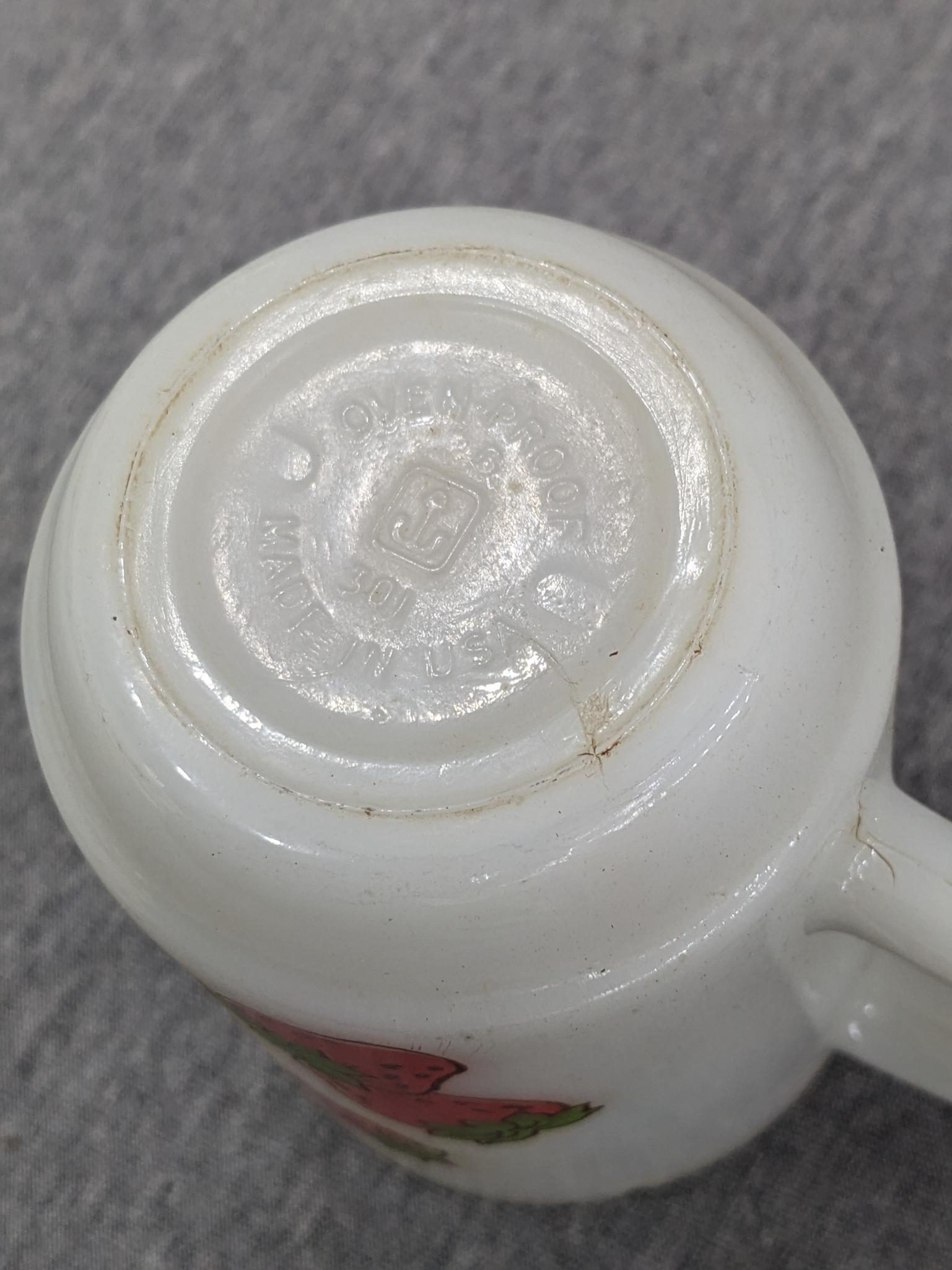 Three old Strawberry Shortcake mugs were made by Anchor Hocking. A couple chips noted on one rim and