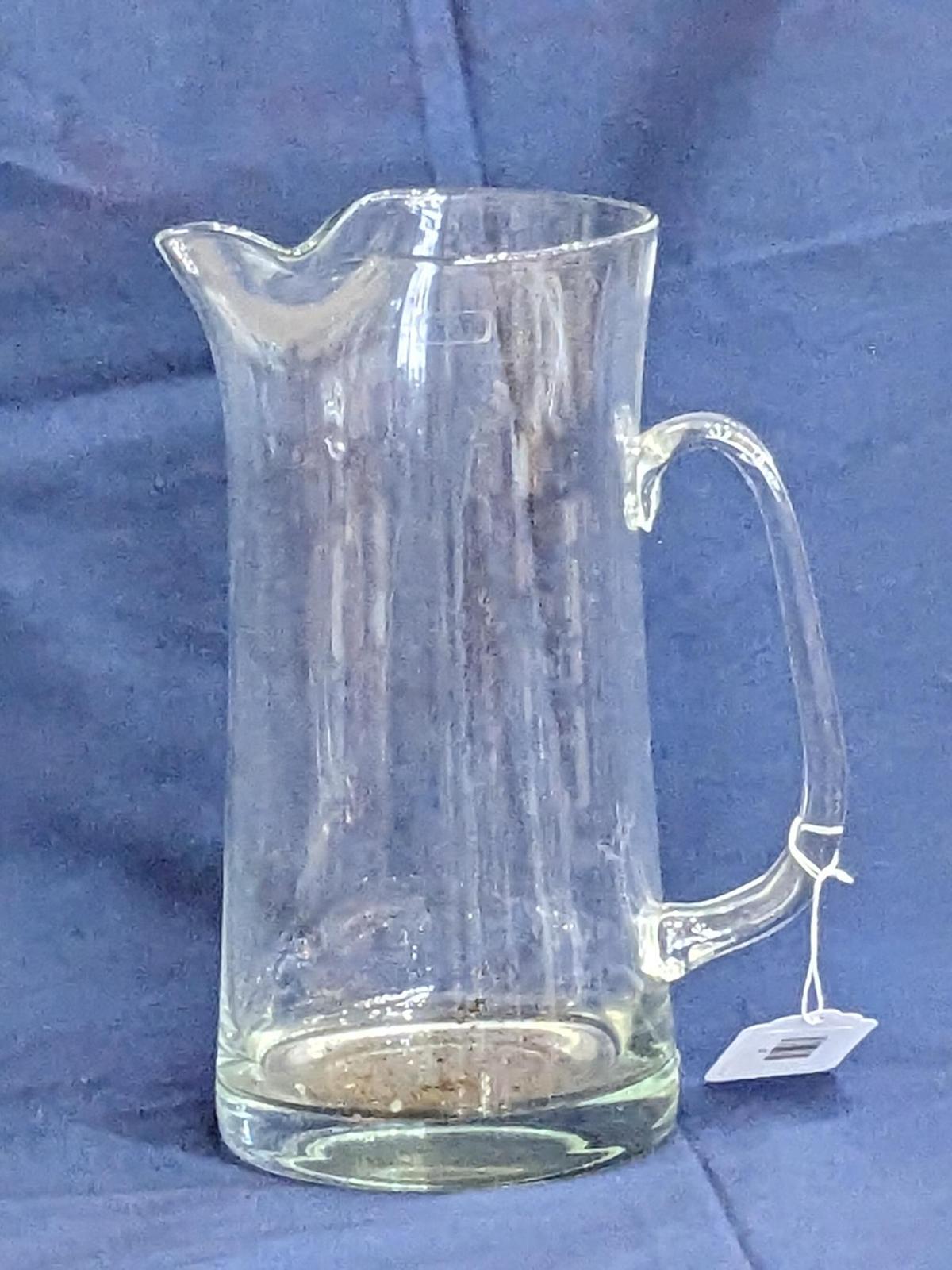 Hand made Tuscany pitcher with applied handle was made in Romania. In good condition, larger than