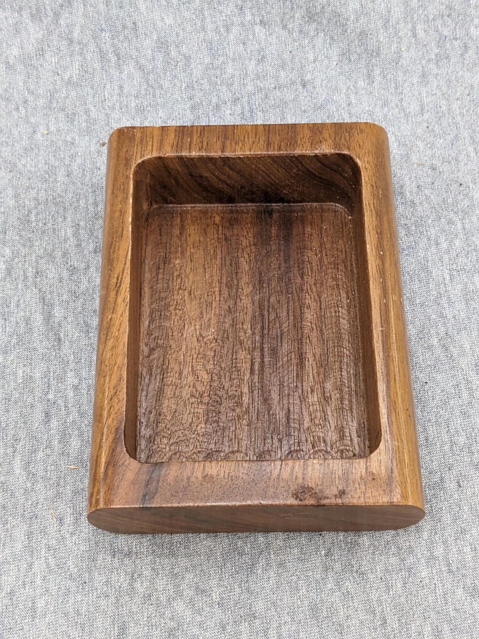 5" wooden dog box, 10-1/2" footed bowl, two hangable cutting boards (one is monkey wood, other