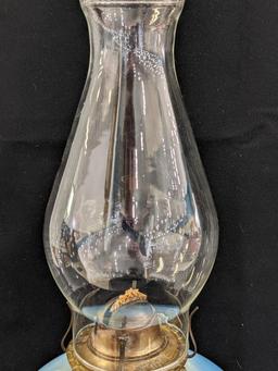 Pretty parlor oil lamp is 17" over chimney and has Eagle burner. For decoration only, notable chips