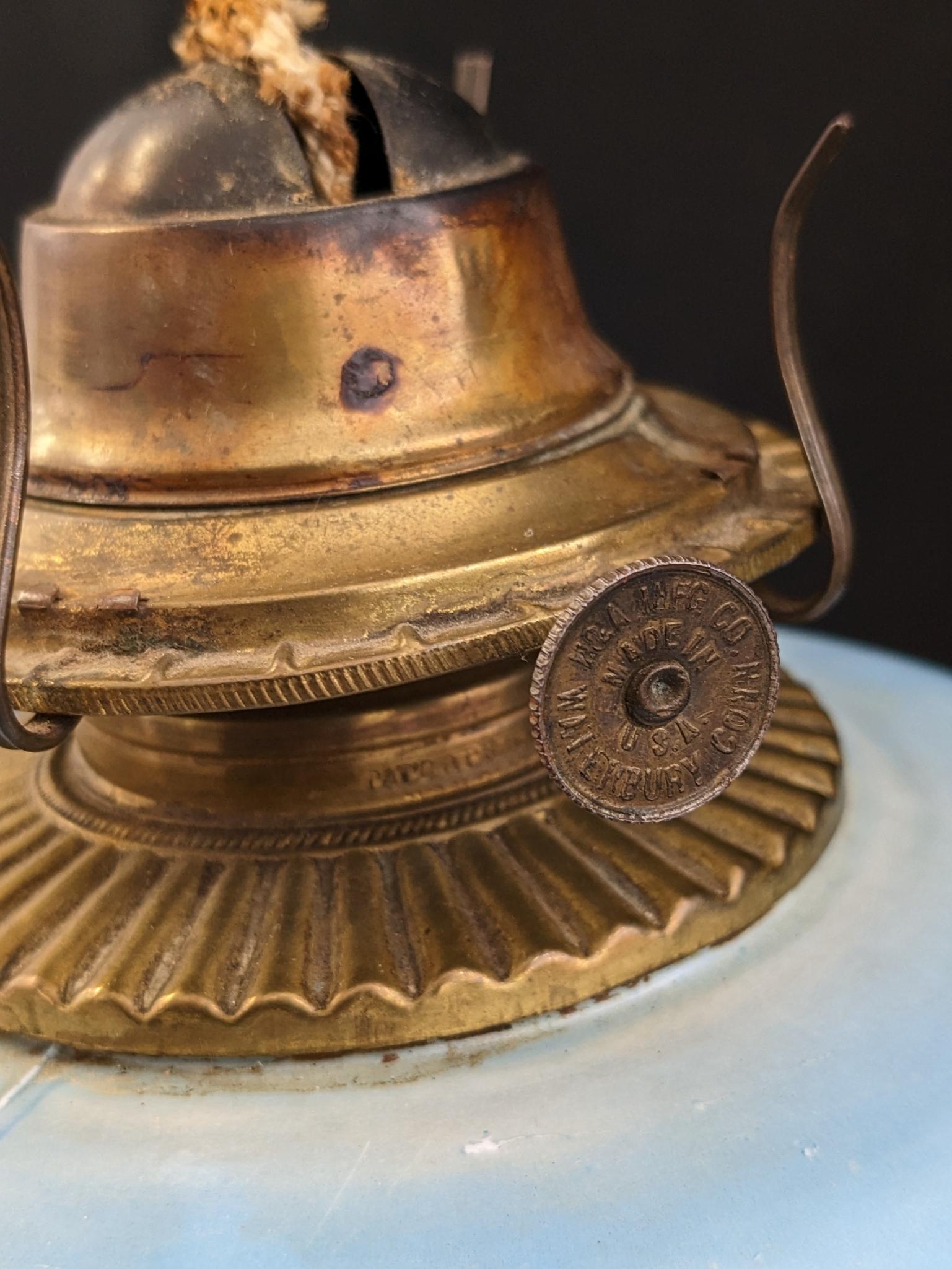 Pretty parlor oil lamp is 17" over chimney and has Eagle burner. For decoration only, notable chips
