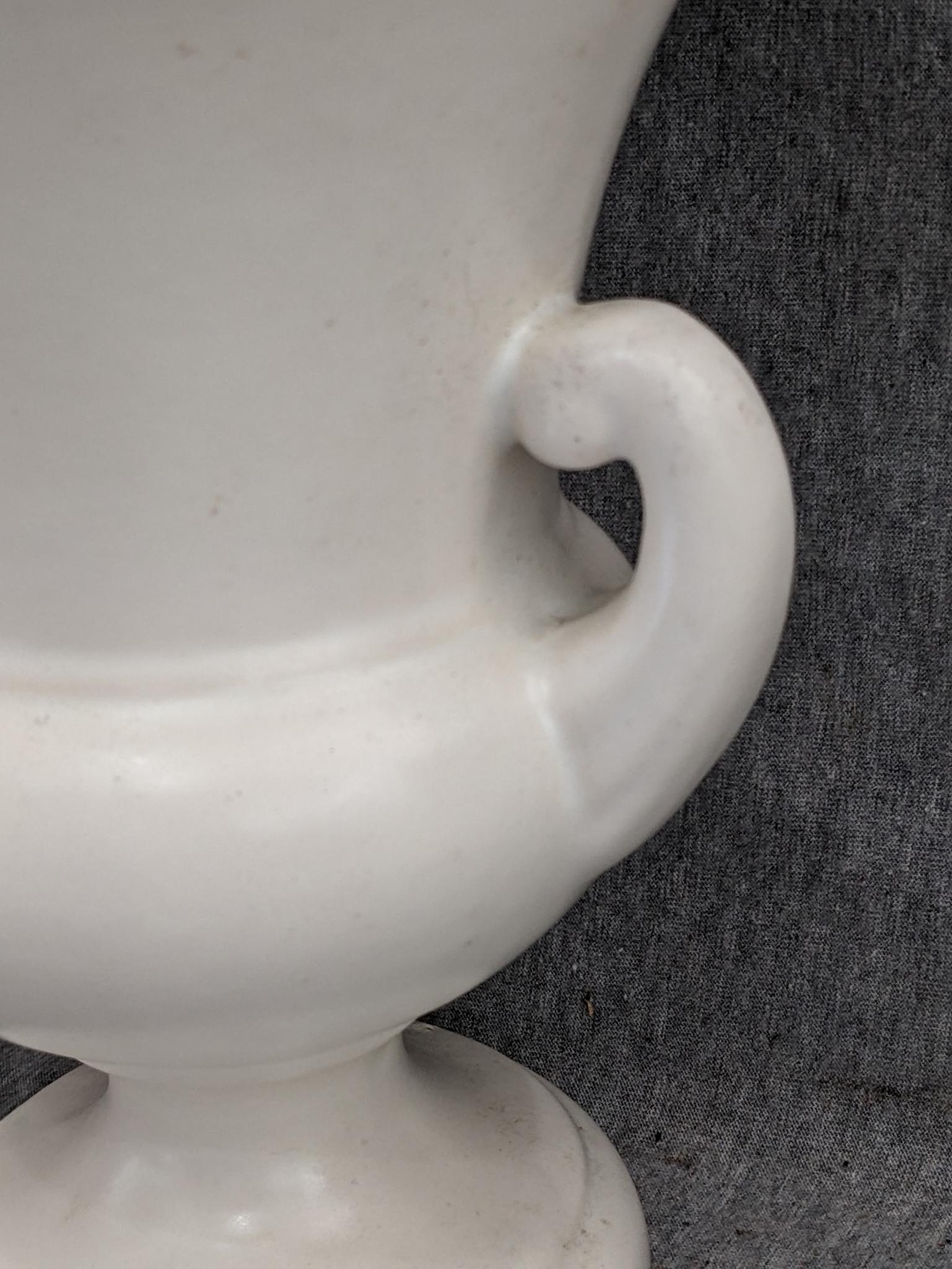 Haeger and other vase are both about 9-1/2" tall. Hairline crack noted on each rim, but otherwise