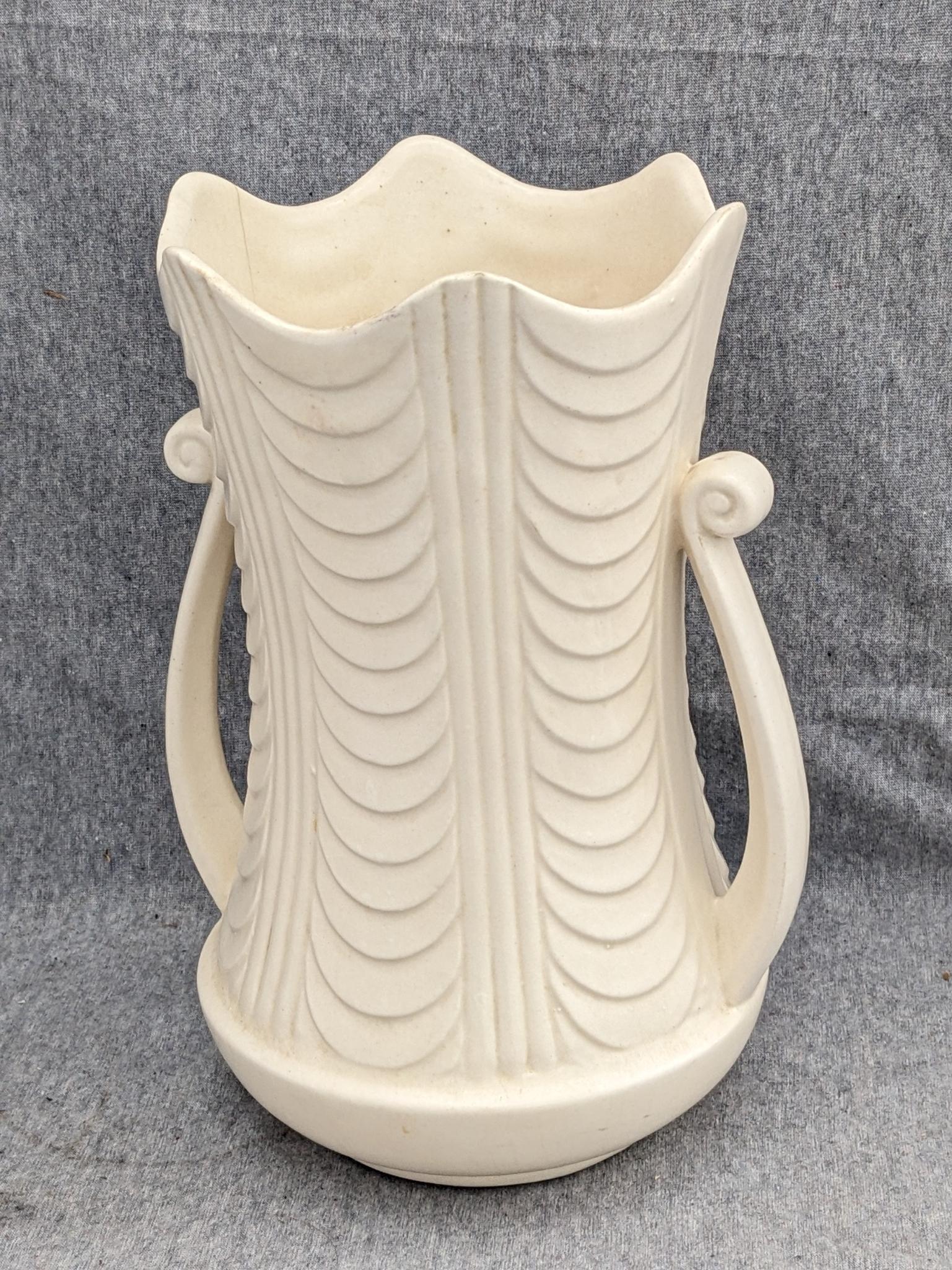 Haeger and other vase are both about 9-1/2" tall. Hairline crack noted on each rim, but otherwise
