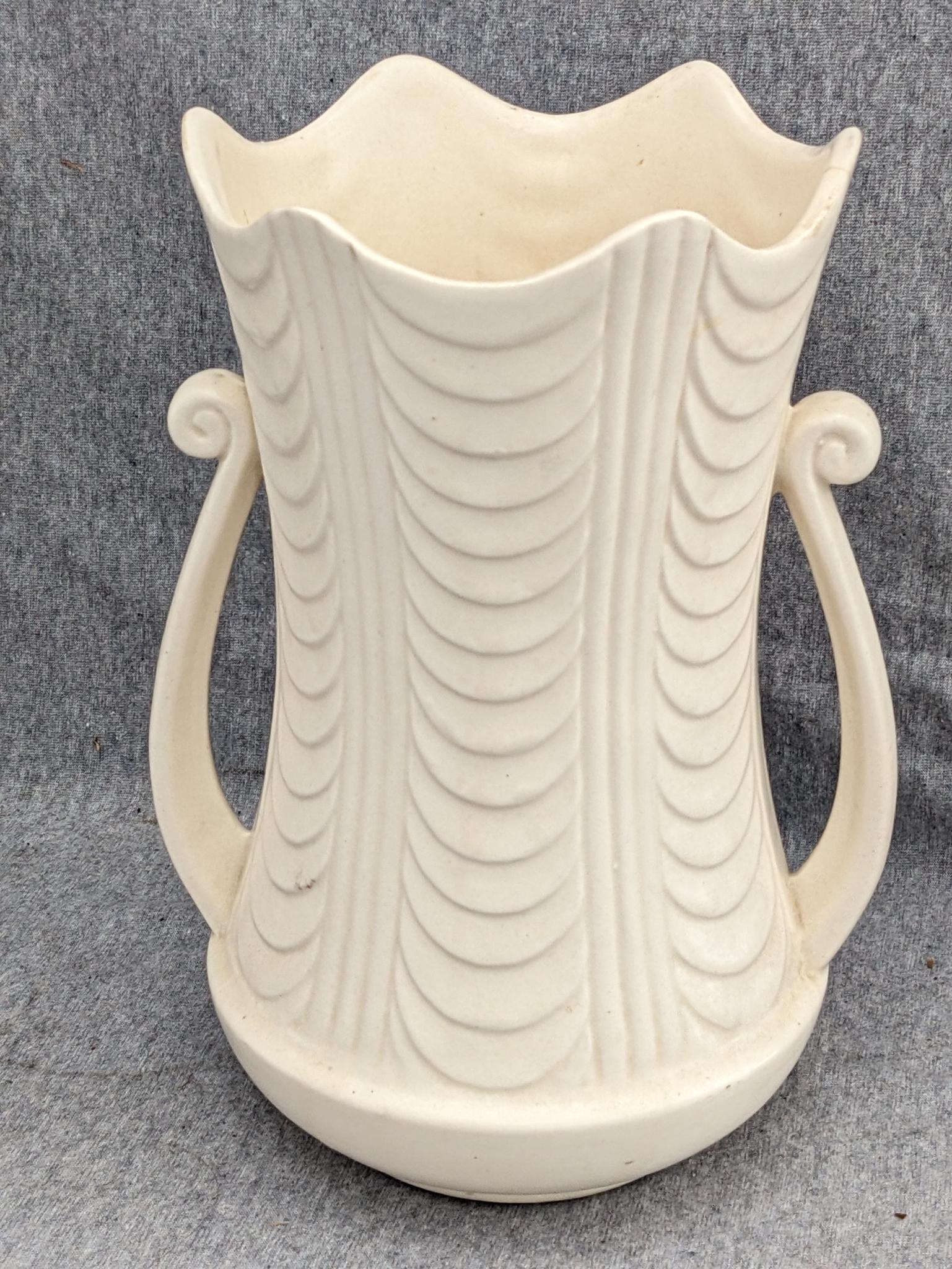 Haeger and other vase are both about 9-1/2" tall. Hairline crack noted on each rim, but otherwise