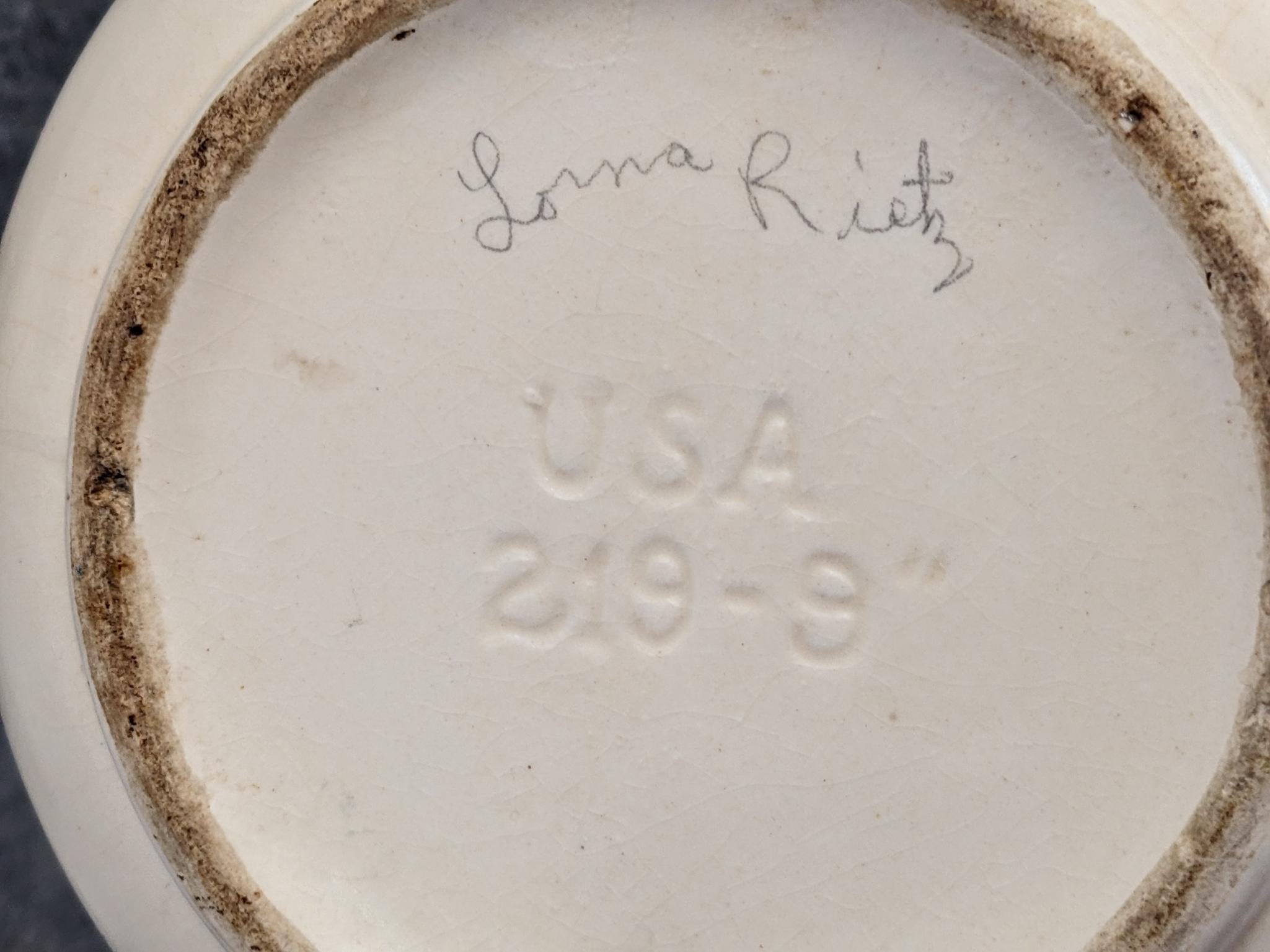 Haeger and other vase are both about 9-1/2" tall. Hairline crack noted on each rim, but otherwise