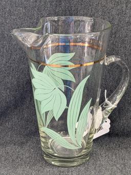 Vintage Pitcher has applied handle and gold stripe in good condition, 10" tall. Neat piece.