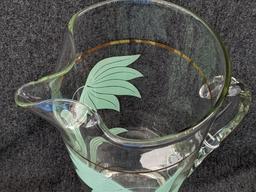 Vintage Pitcher has applied handle and gold stripe in good condition, 10" tall. Neat piece.