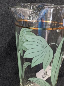 Vintage Pitcher has applied handle and gold stripe in good condition, 10" tall. Neat piece.
