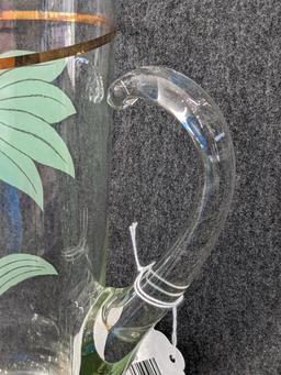 Vintage Pitcher has applied handle and gold stripe in good condition, 10" tall. Neat piece.