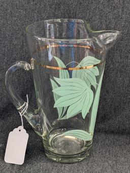 Vintage Pitcher has applied handle and gold stripe in good condition, 10" tall. Neat piece.