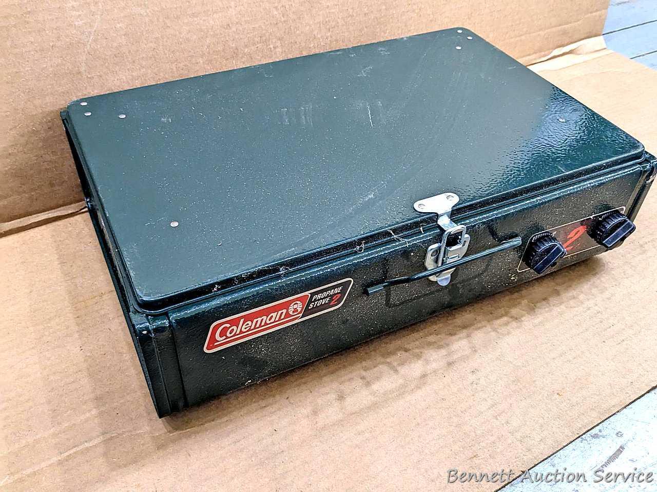 Coleman two burner propane camp stove is 18" x 12" x 5" and comes with original box.