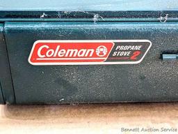 Coleman two burner propane camp stove is 18" x 12" x 5" and comes with original box.