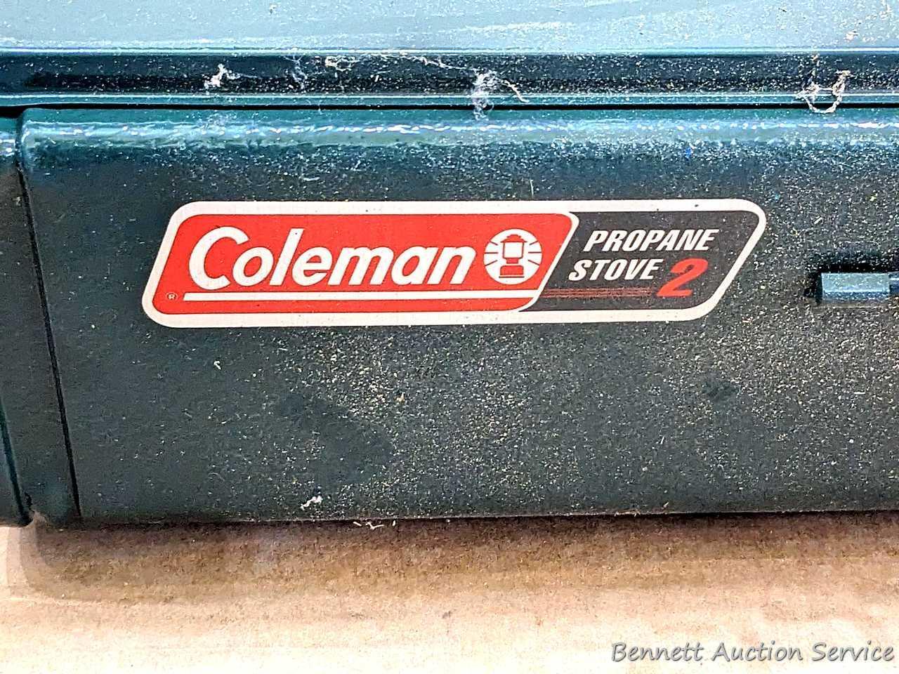 Coleman two burner propane camp stove is 18" x 12" x 5" and comes with original box.