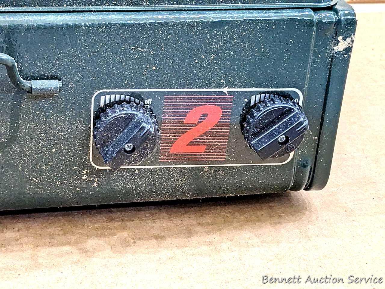 Coleman two burner propane camp stove is 18" x 12" x 5" and comes with original box.
