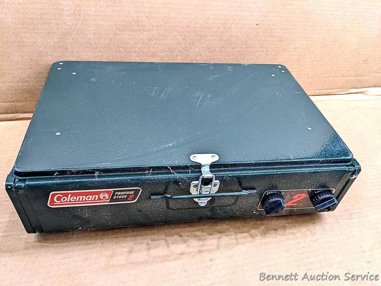 Coleman two burner propane camp stove is 18" x 12" x 5" and comes with original box.
