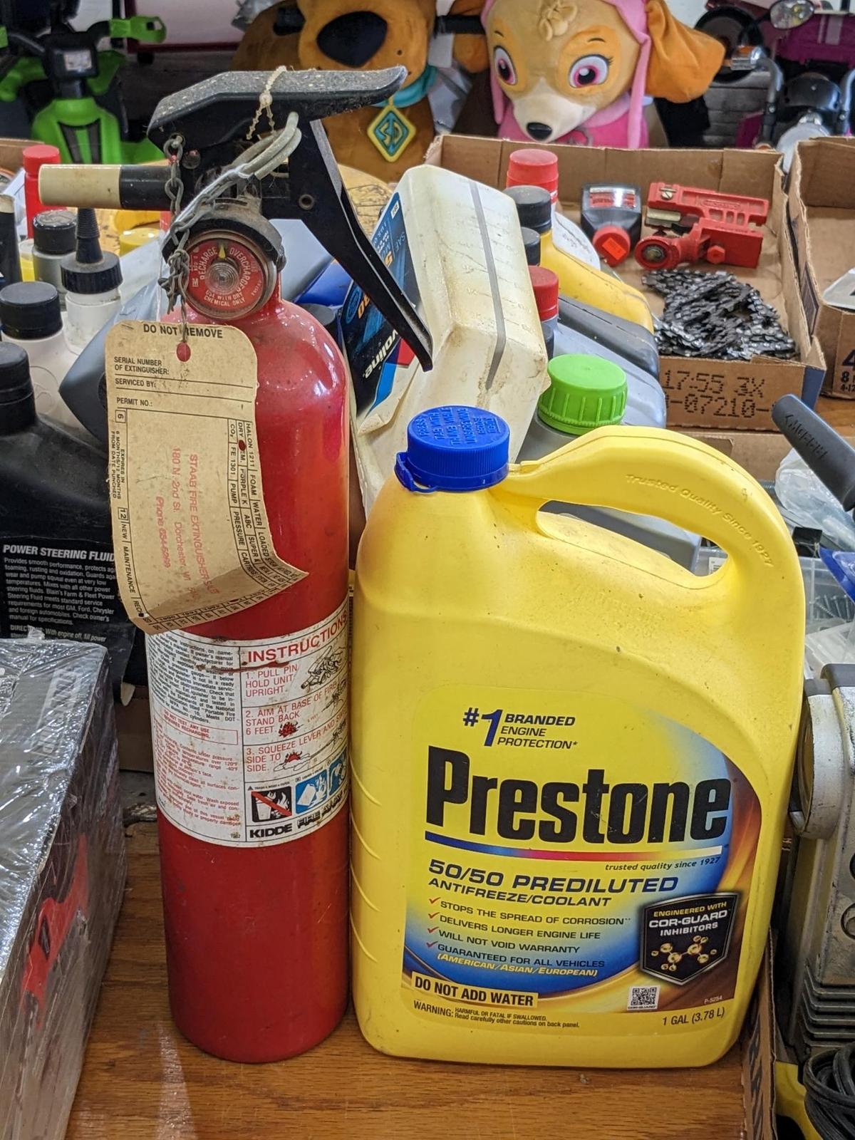 No shipping. Kidde fire extinguisher, gauge reads charged, and a 1 gallon jug of Prestone 50/50