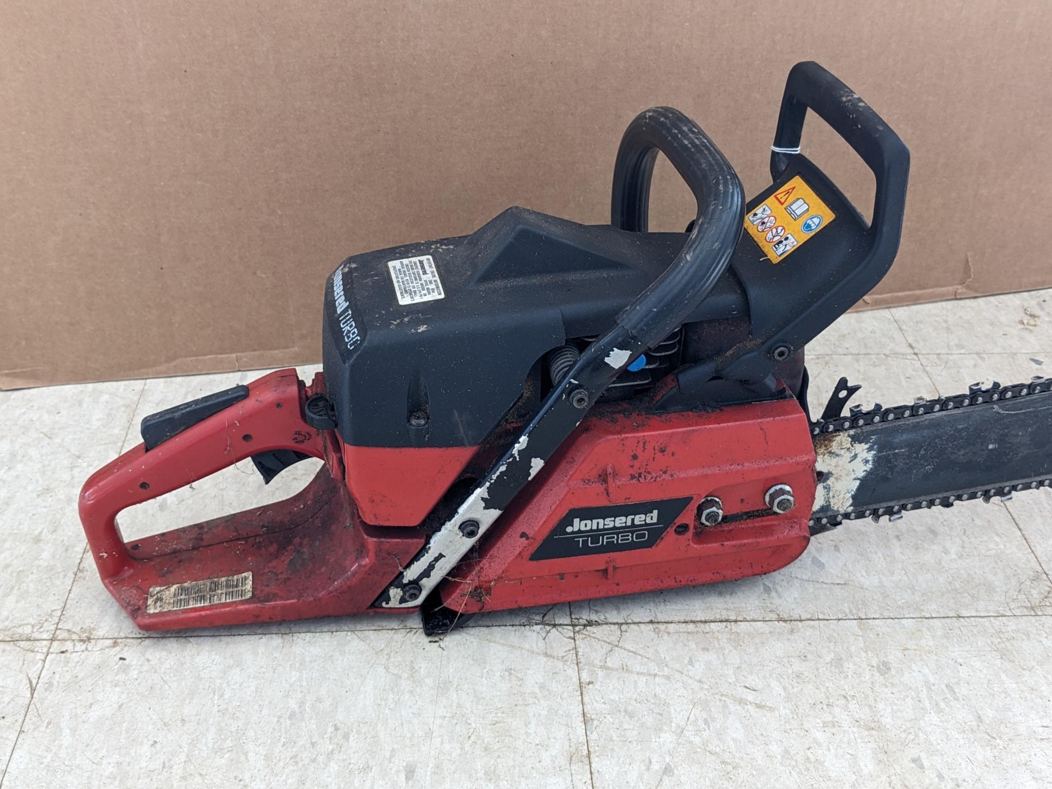 Jonsered 2065 Turbo chainsaw with a 20" bar and an impressive 65 cc engine. Comes with bar cover and