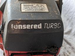 Jonsered 2065 Turbo chainsaw with a 20" bar and an impressive 65 cc engine. Comes with bar cover and