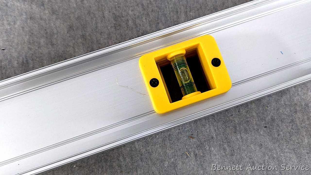 2 Sets of construction levels, one set is orange plastic and measures 24"; second set is aluminum