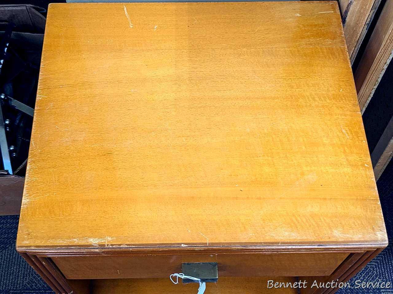 Bedside or end table with fixed shelves and drawer. Measures 26" tall, x 16" wide x 14" deep. Drawer