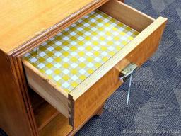 Bedside or end table with fixed shelves and drawer. Measures 26" tall, x 16" wide x 14" deep. Drawer