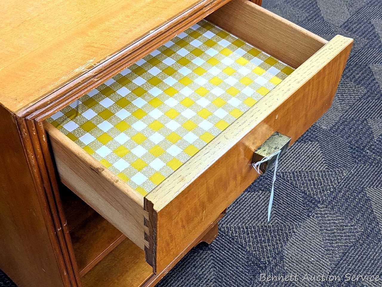 Bedside or end table with fixed shelves and drawer. Measures 26" tall, x 16" wide x 14" deep. Drawer