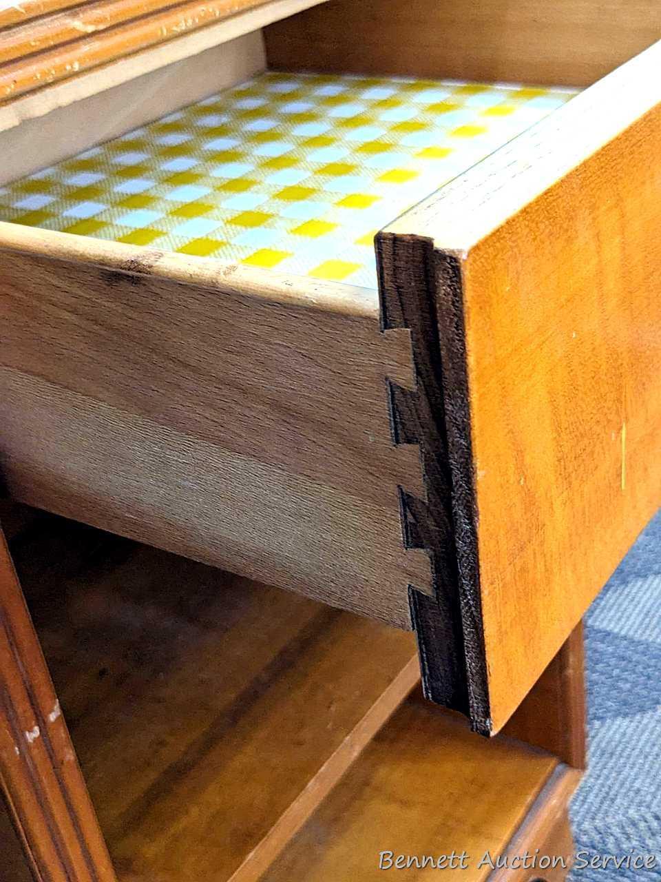 Bedside or end table with fixed shelves and drawer. Measures 26" tall, x 16" wide x 14" deep. Drawer