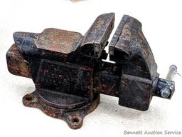 Columbian 4" swiveling bench vice. The vise in in pretty good condition with worn jaws, overall nice