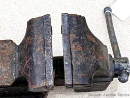 Columbian 4" swiveling bench vice. The vise in in pretty good condition with worn jaws, overall nice