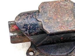 Columbian 4" swiveling bench vice. The vise in in pretty good condition with worn jaws, overall nice