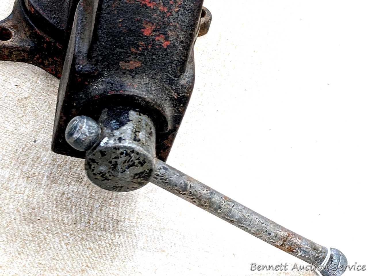 Columbian 4" swiveling bench vice. The vise in in pretty good condition with worn jaws, overall nice