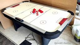 Harvard air hockey game table. Works! Measures 7' x 4' x 32" high and comes with discs and paddles.