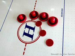 Harvard air hockey game table. Works! Measures 7' x 4' x 32" high and comes with discs and paddles.