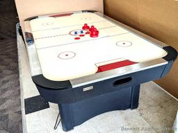 Harvard air hockey game table. Works! Measures 7' x 4' x 32" high and comes with discs and paddles.