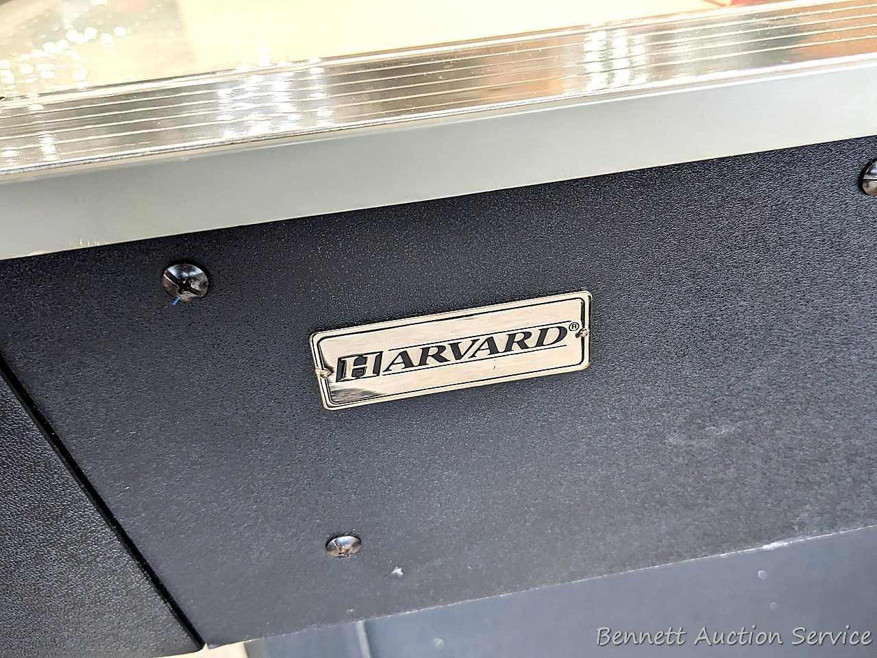 Harvard air hockey game table. Works! Measures 7' x 4' x 32" high and comes with discs and paddles.