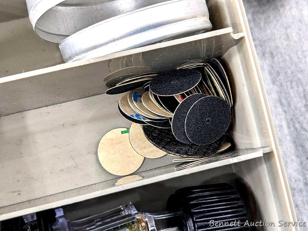 Dremel brand rotary tool attachments, plus a variety of sanding discs, drum sander pieces, cutting