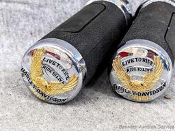 Pair of Harley Davidson Motorcycles handlebar grips read on the ends 'Live to Ride, Ride to Live'.