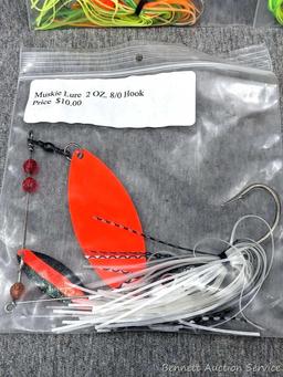 Seller notes three muskie lures, plus three bags of 2-1/2" barrel swivels with snaps. Spinnerbaits