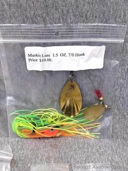 Seller notes three muskie lures, plus three bags of 2-1/2" barrel swivels with snaps. Spinnerbaits