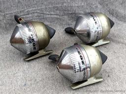 3 Zebco 202LE fishing reels. 2 handles spin, one does not spin as smoothly. All about 3-3/4" tall