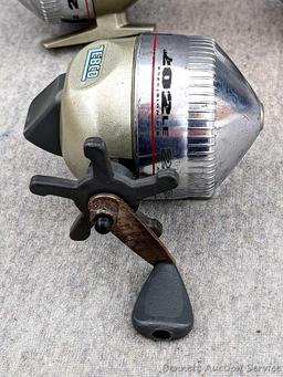 3 Zebco 202LE fishing reels. 2 handles spin, one does not spin as smoothly. All about 3-3/4" tall
