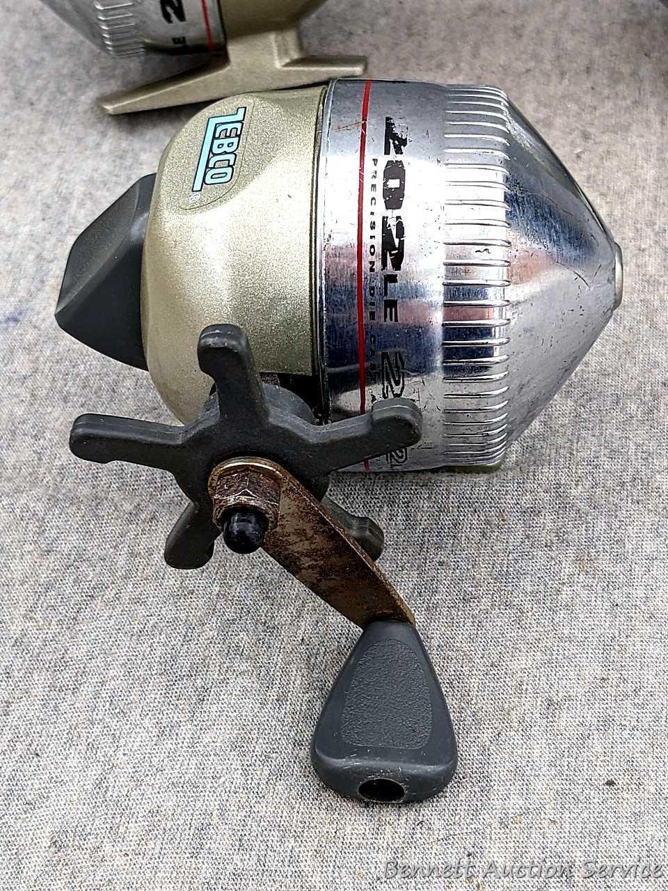 3 Zebco 202LE fishing reels. 2 handles spin, one does not spin as smoothly. All about 3-3/4" tall