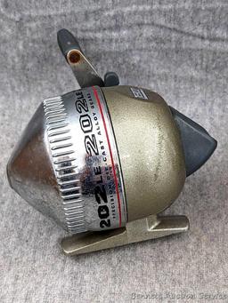 3 Zebco 202LE fishing reels. 2 handles spin, one does not spin as smoothly. All about 3-3/4" tall