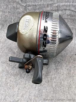 3 Zebco 202LE fishing reels. 2 handles spin, one does not spin as smoothly. All about 3-3/4" tall