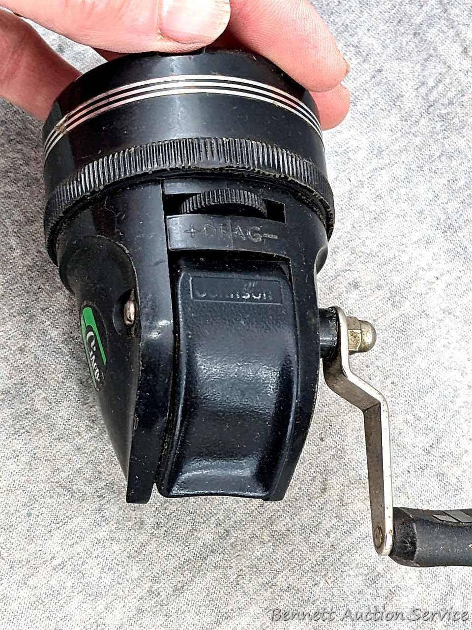 Vintage Johnson fishing reel plus another Johnson reel and a Cisco reel. All handles turn smoothly.
