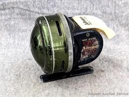 Vintage Johnson fishing reel plus another Johnson reel and a Cisco reel. All handles turn smoothly.