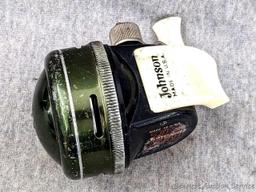 Vintage Johnson fishing reel plus another Johnson reel and a Cisco reel. All handles turn smoothly.
