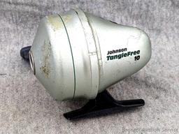 Vintage Johnson fishing reel plus another Johnson reel and a Cisco reel. All handles turn smoothly.